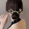 Rhinestone hairpin pearl bun artifact